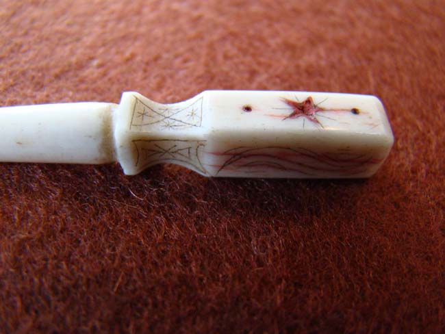 A charming 19th century sailor carved whalebone bodkin with red ink decoration and initials 'M A F' — image 3